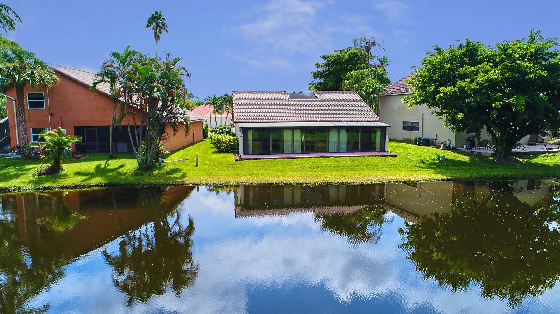 10404 Islander Drive Boca Raton, FL 33498 - Photo 7 of 44 Exterior Back w/ Lake View