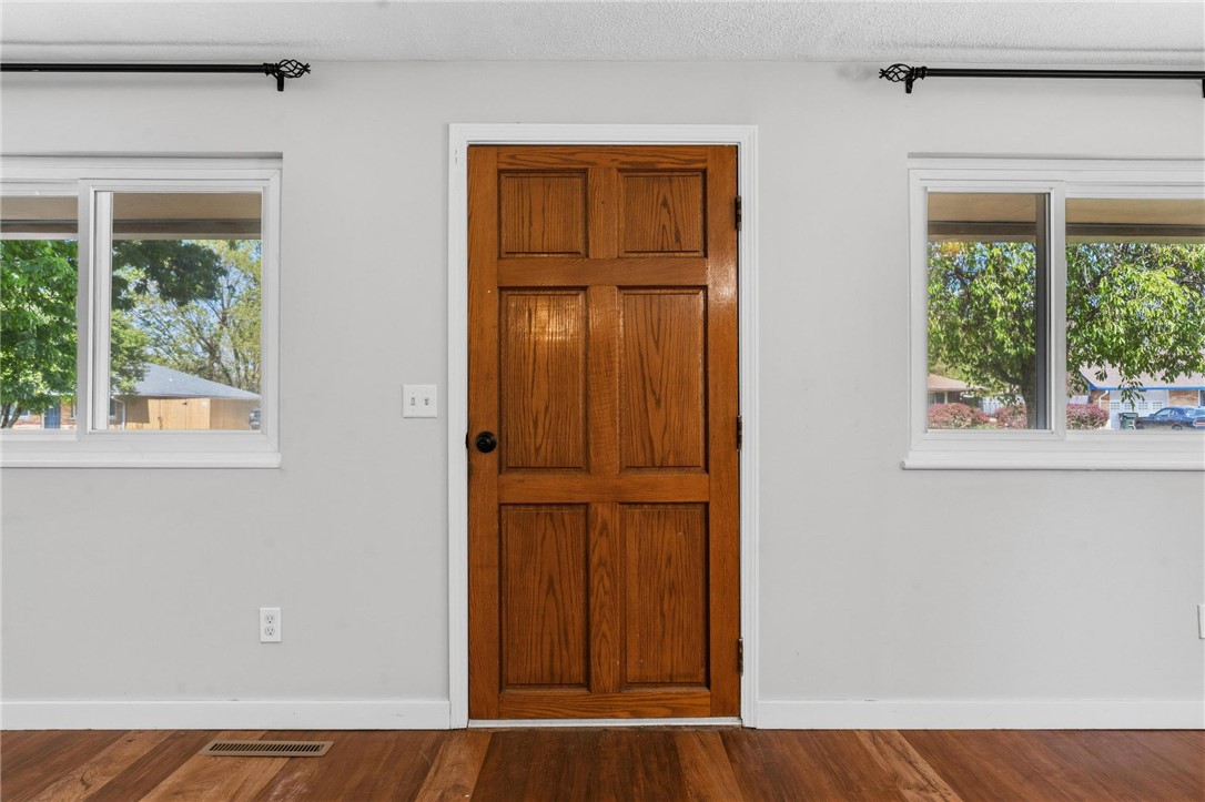 3690 Endover Road Dayton, OH 45439 - Photo 5 of 25 A classic wooden door welcomes you, flanked by bright windows