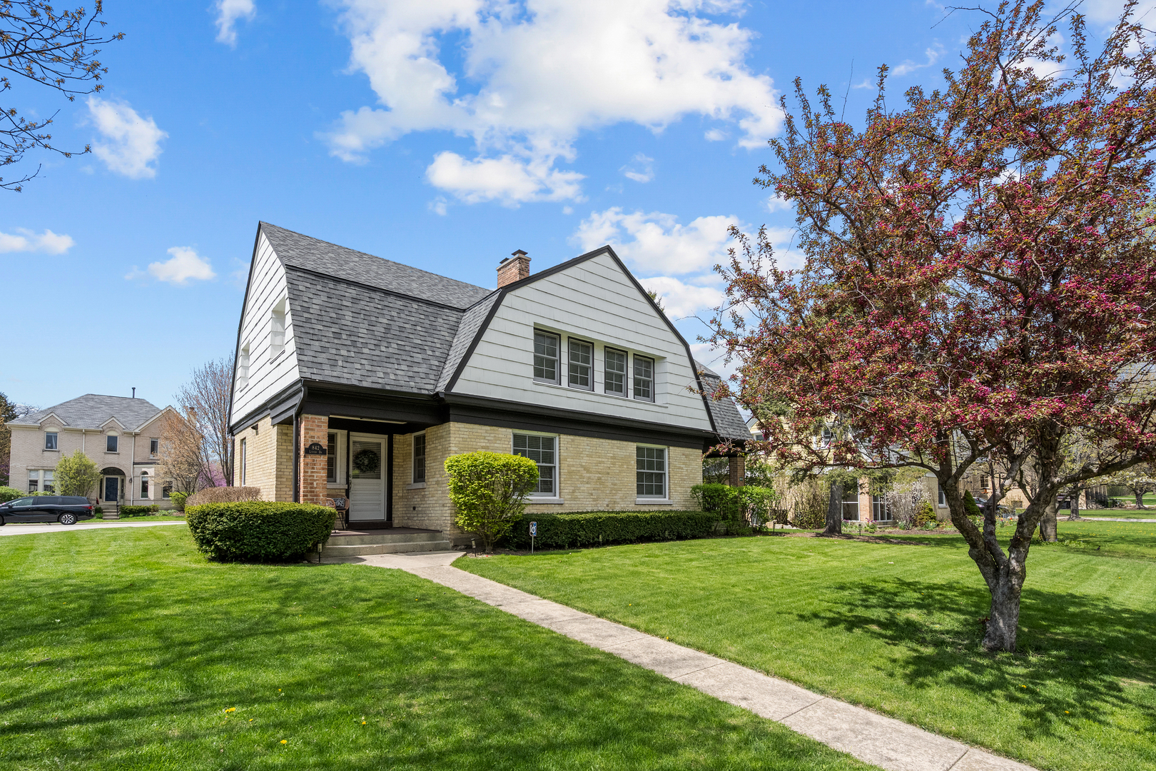 a front view of a house with a yard