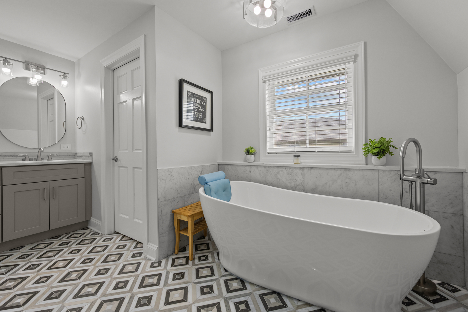 842 Lyster Road Highwood, IL 60040 - Photo 17 of 26 a bath tub sitting in a bathroom next to a window