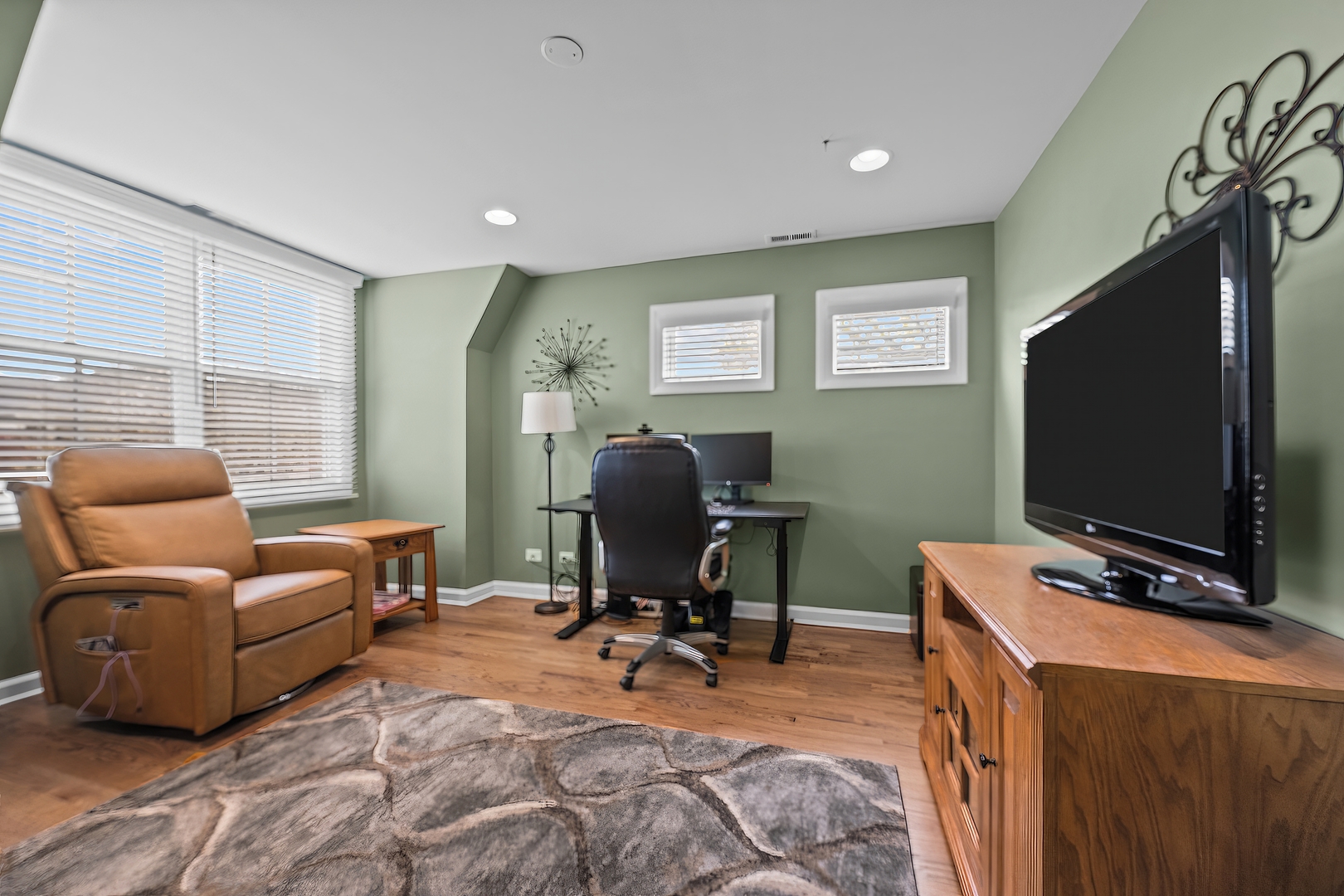 842 Lyster Road Highwood, IL 60040 - Photo 18 of 26 a living room with furniture and a flat screen tv