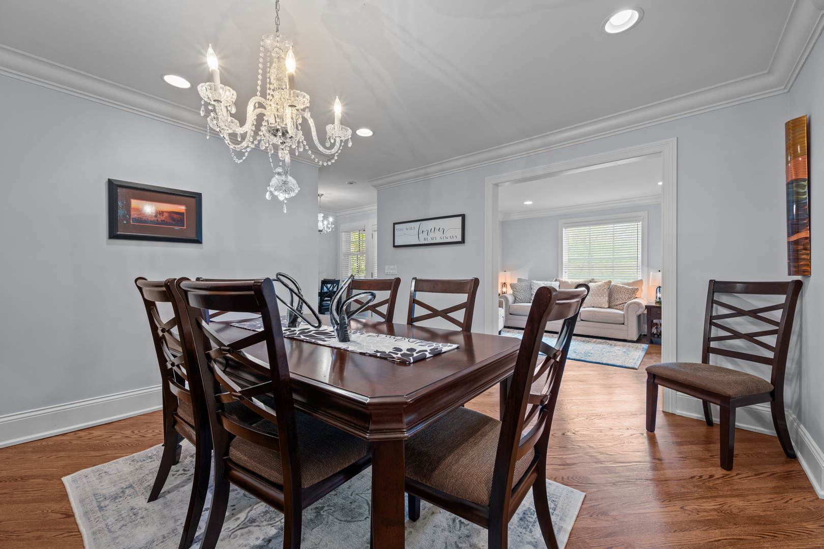 842 Lyster Road Highwood, IL 60040 - Photo 8 of 26 a view of a dining room with furniture a chandelier and wooden floor