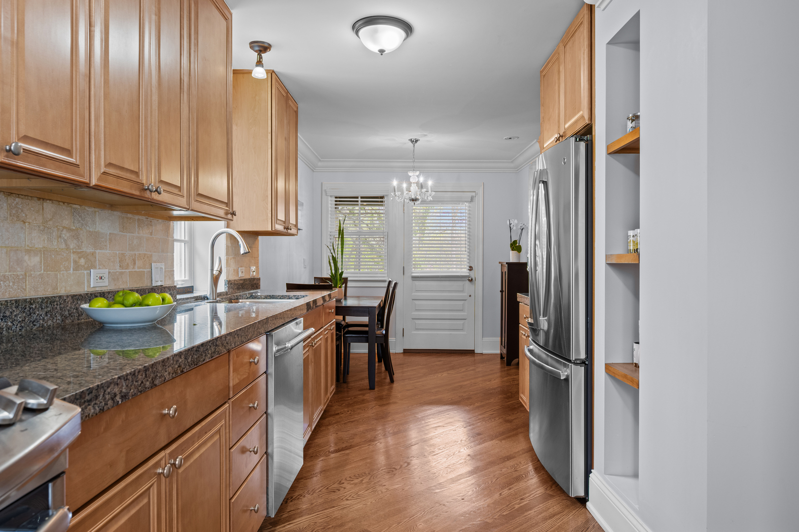 842 Lyster Road Highwood, IL 60040 - Photo 9 of 26 a kitchen with stainless steel appliances granite countertop a refrigerator and a sink