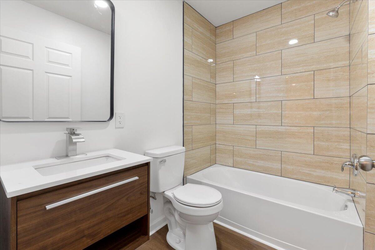 127 State Pulaski, VA 24301 - Photo 11 of 35 a bathroom with a sink a toilet and shower