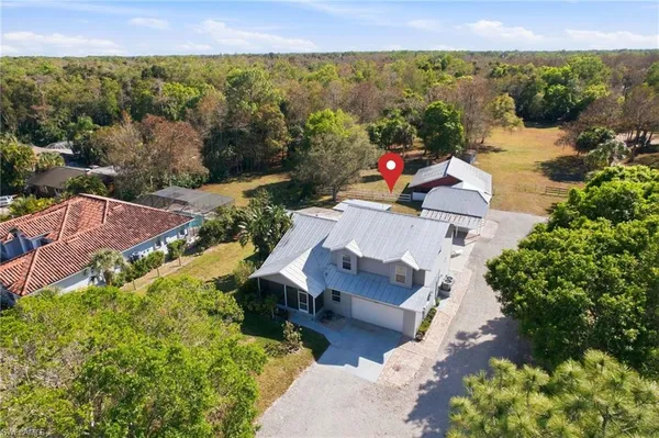 an aerial view of a house with a garden