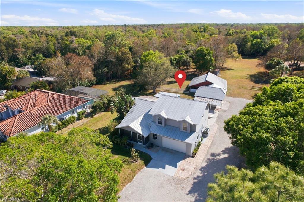 5860 Dogwood Way Naples, FL 34116 - Photo 1 of 36 an aerial view of a house with a garden