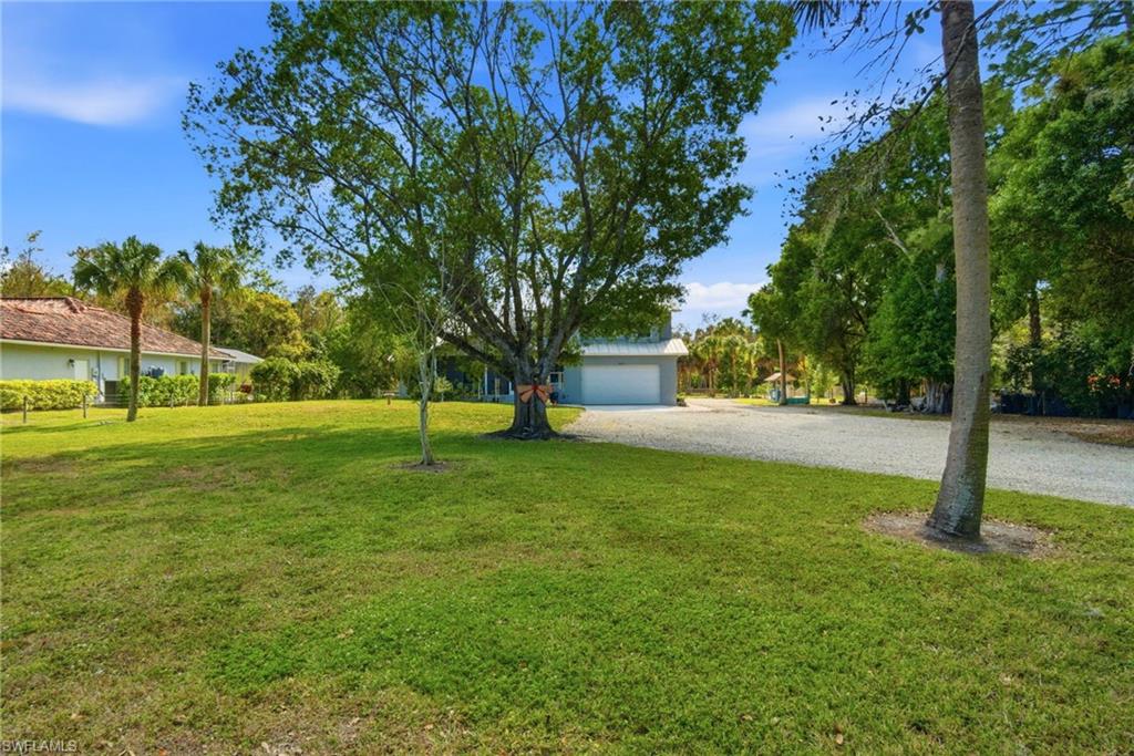 5860 Dogwood Way Naples, FL 34116 - Photo 15 of 36 a view of a park with large trees