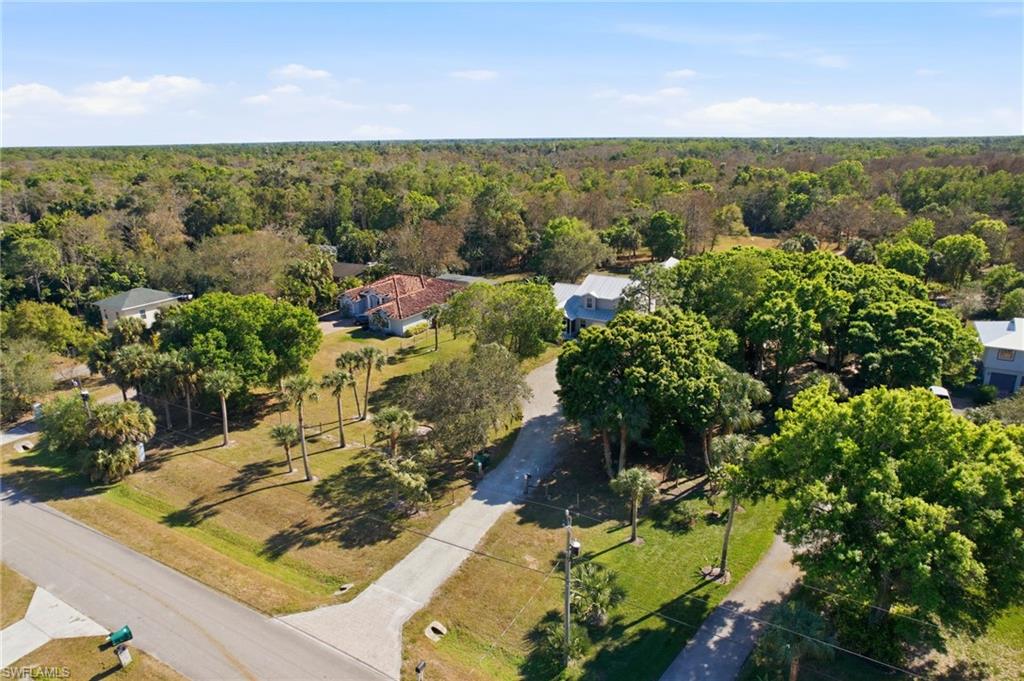 5860 Dogwood Way Naples, FL 34116 - Photo 27 of 36 a view of a lake with a mountain in the background