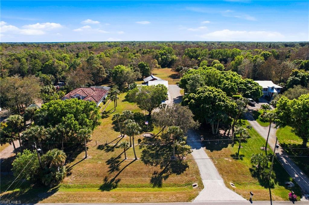 5860 Dogwood Way Naples, FL 34116 - Photo 7 of 36 a view of a yard with outside dining space