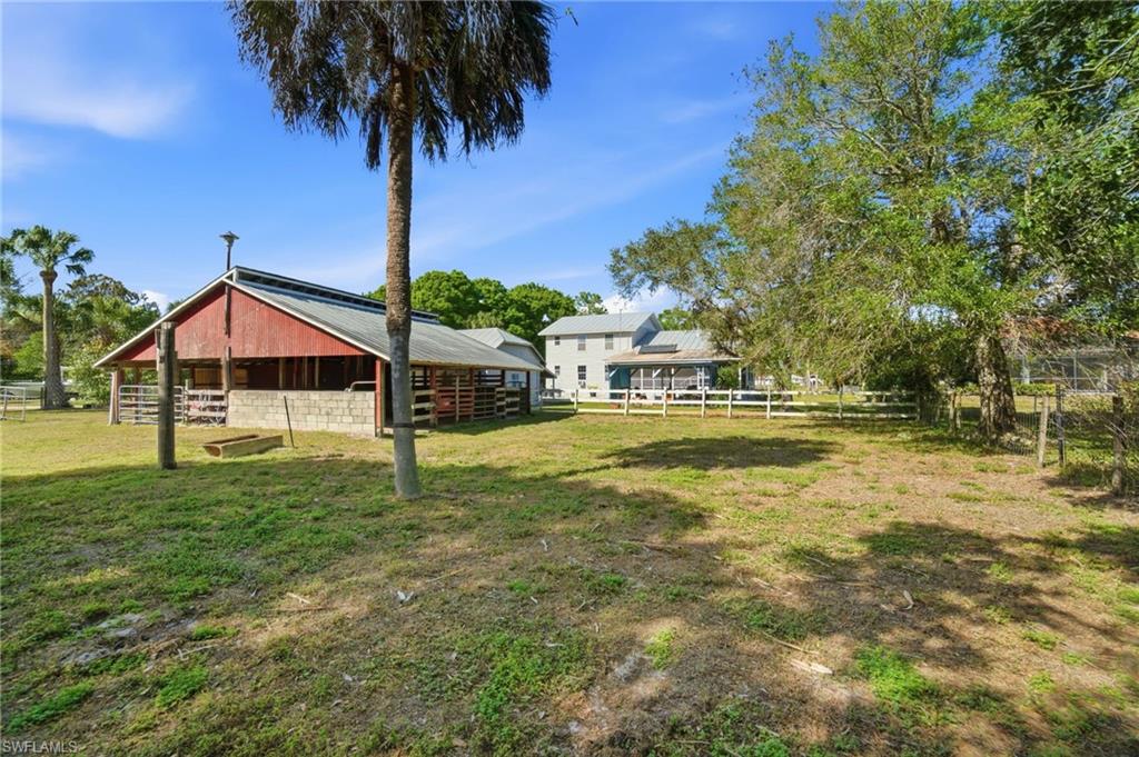 5860 Dogwood Way Naples, FL 34116 - Photo 10 of 36 a house with swimming pool in front of it