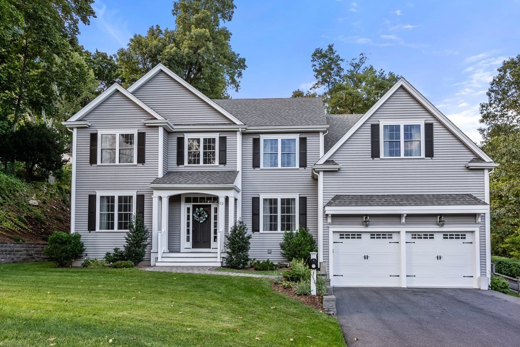 front view of a house with a yard