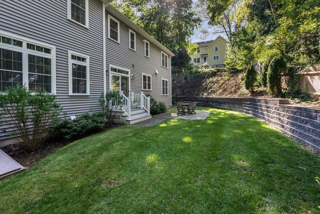 22 Dunedin Road Wellesley, MA 02481 - Photo 16 of 16 a view of a house with backyard and sitting area
