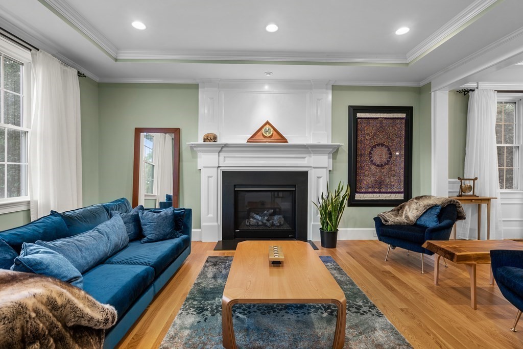 22 Dunedin Road Wellesley, MA 02481 - Photo 3 of 16 a living room with furniture and a fireplace