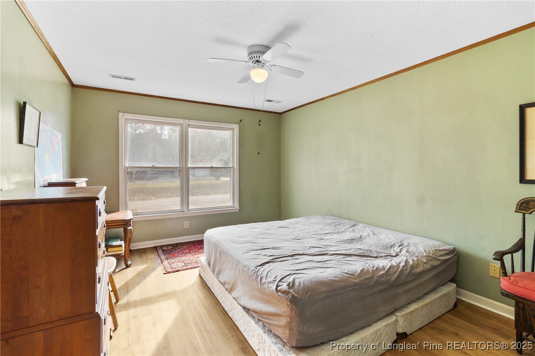 1132 Hoke Loop Road Fayetteville, NC 28314 - Photo 17 of 29 a bedroom with a bed and a window