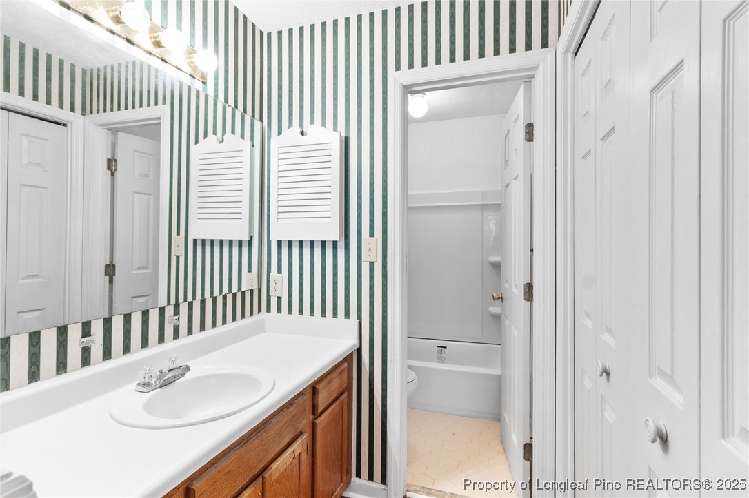 1132 Hoke Loop Road Fayetteville, NC 28314 - Photo 19 of 29 a bathroom with a sink and a mirror