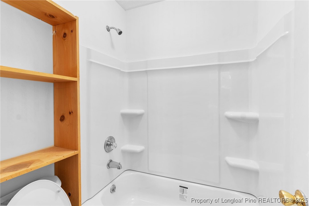 1132 Hoke Loop Road Fayetteville, NC 28314 - Photo 20 of 29 a bathroom with a bathtub and shower