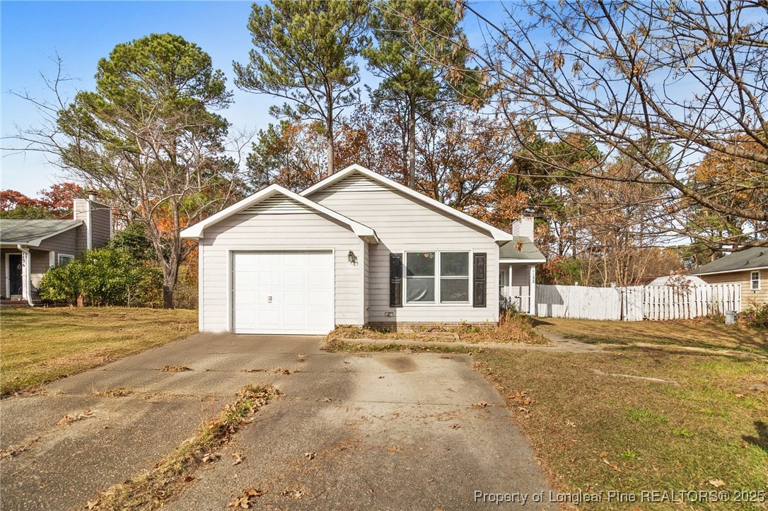 1132 Hoke Loop Road Fayetteville, NC 28314 - Photo 5 of 29 a front view of a house with a yard