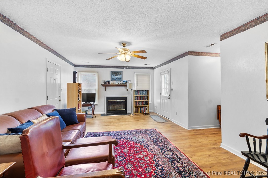 1132 Hoke Loop Road Fayetteville, NC 28314 - Photo 10 of 29 a living room with furniture and a fireplace