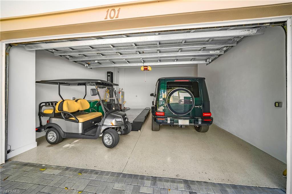 6552 Dominica Drive, Unit 101 Naples, FL 34113 - Photo 30 of 50 a car parked in garage