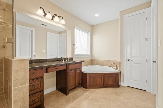 a bathroom with a sink double vanity and a mirror