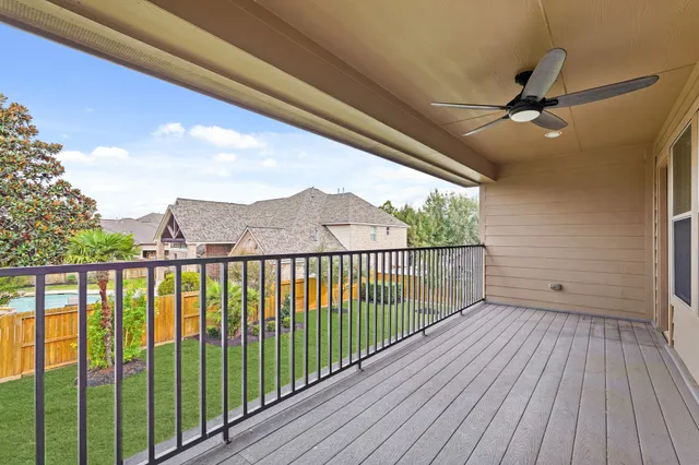 a view of a balcony with wooden floor
