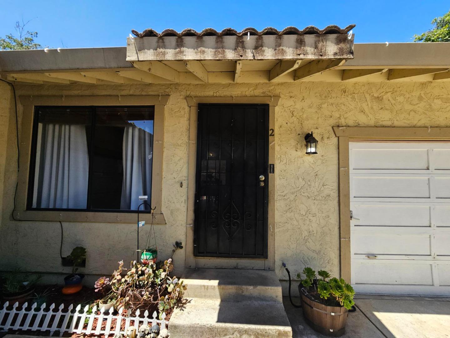 6725 Imperial Drive Gilroy, CA 95020 - Photo 3 of 8 a front view of a house with a yard