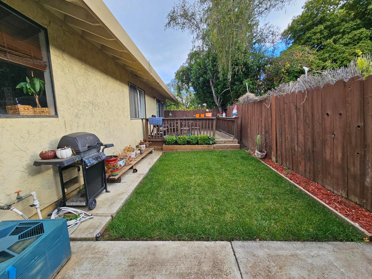 6725 Imperial Drive Gilroy, CA 95020 - Photo 7 of 8 a view of backyard with a garden and deck