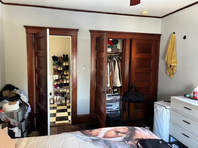 a bedroom with a bed and a closet