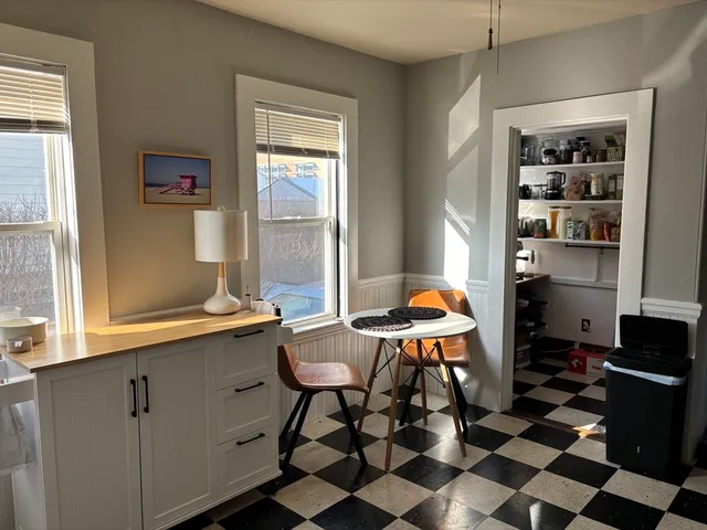 a room with furniture a rug and a window