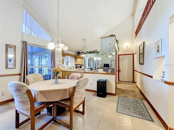 a spacious bedroom with a bed and dresser