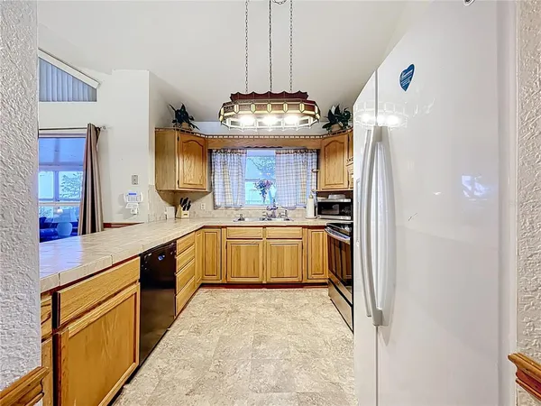 a bathroom with a sink a toilet a mirror and bathtub