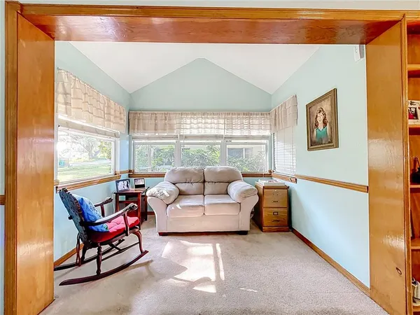 a bathroom with a sink a toilet a mirror and shower