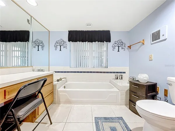 a view of a livingroom with furniture and staircase