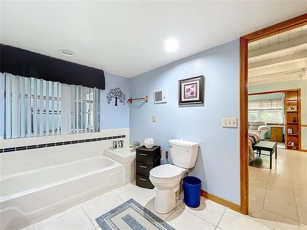 a view of a hallway with furniture