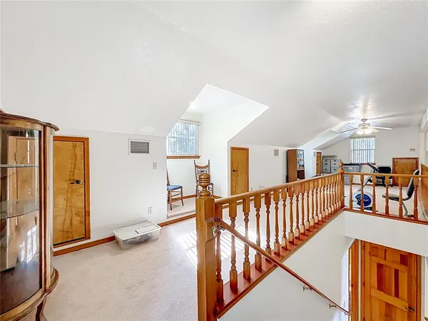 a bathroom with a granite countertop sink toilet a shower and a mirror