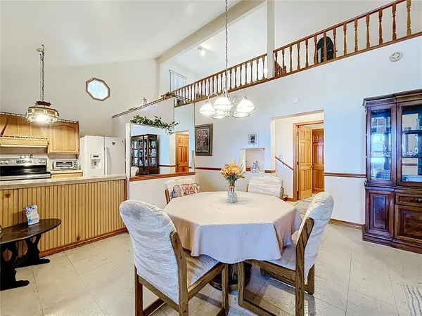 a living room with furniture fireplace and a window