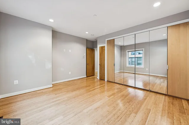 a view of a hallway with washer and dryer