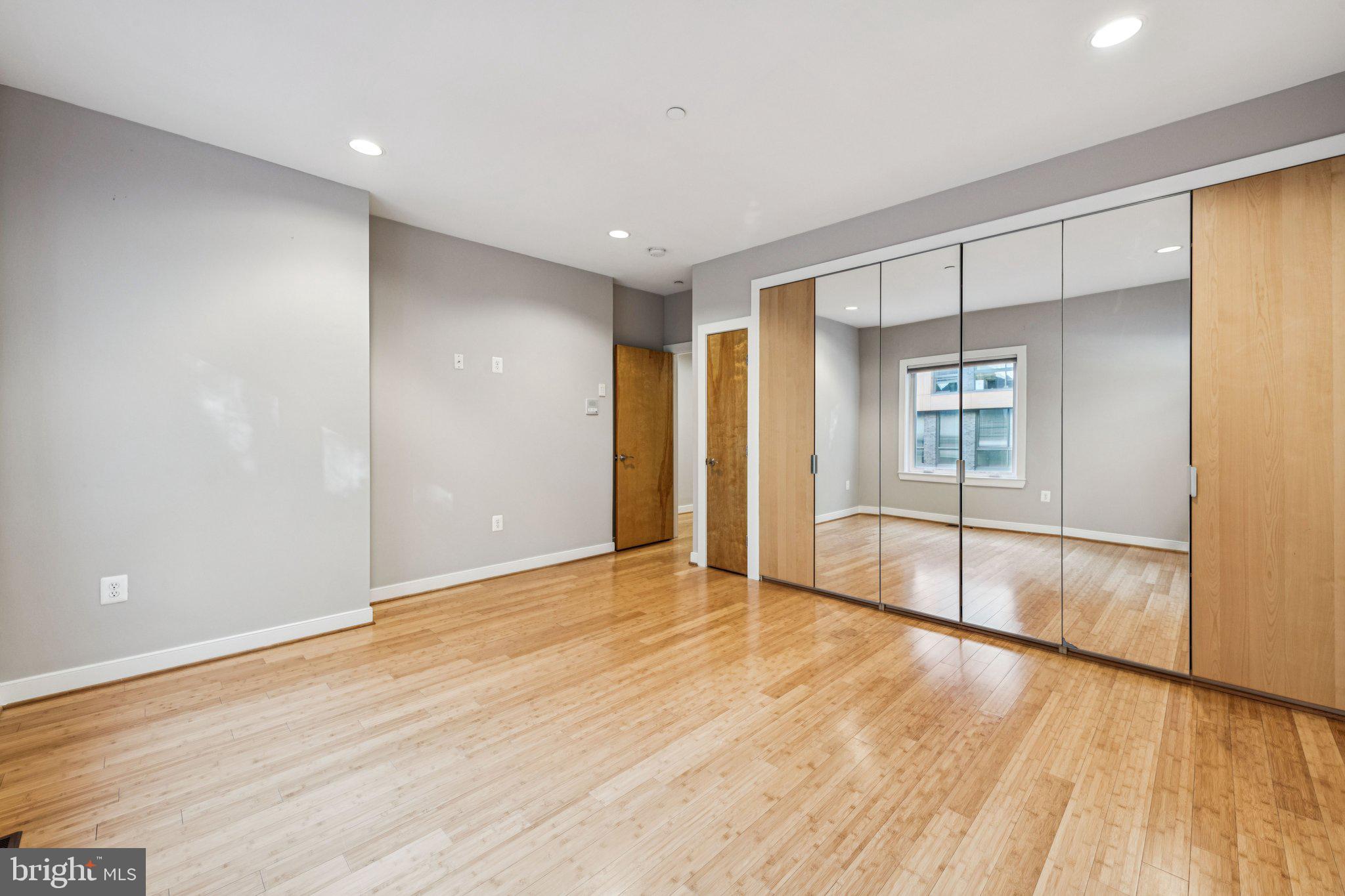 241 R Street Northeast, Unit A Washington, DC 20002 - Photo 24 of 33 wooden floor in an empty room with a window