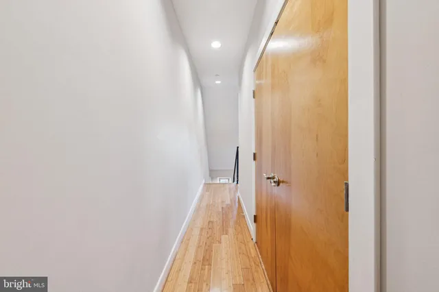 a view of a house with entryway and wooden stairs