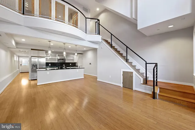 a view of kitchen with cabinets and wooden floor