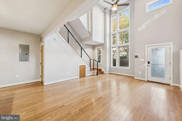 a view of an entryway with wooden floor