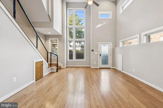 a view of an entryway with wooden floor and stairs