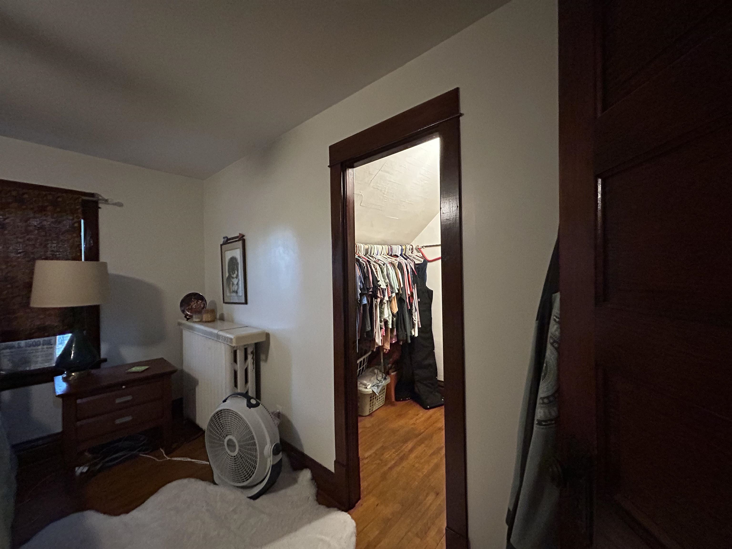 910 North 20th Street Superior, WI 54880 - Photo 11 of 39 Bedroom with wood finished floors and a walk in closet
