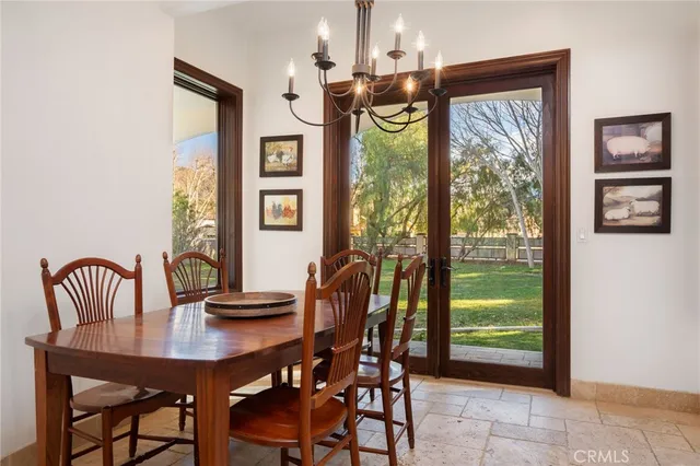 a view of a dining room with furniture and a window