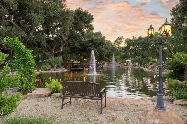 a view of a lake with a bench next to a lake