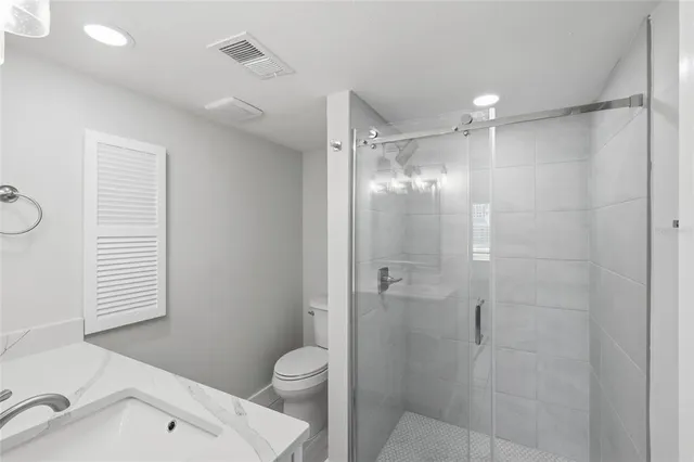 a bathroom with a shower and a toilet