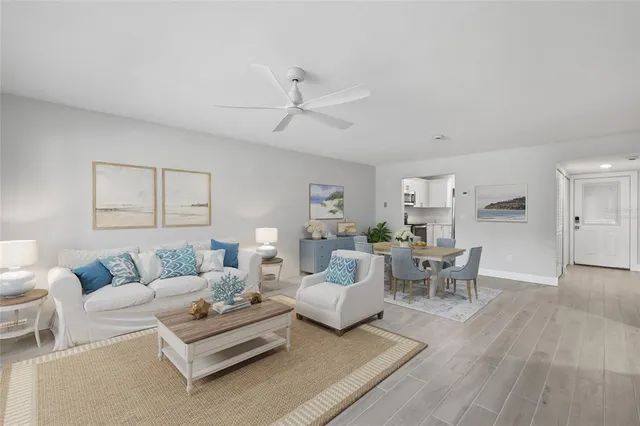 a living room with furniture white walls and white walls