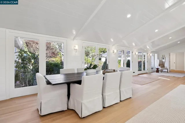a living room with furniture a rug and a large window