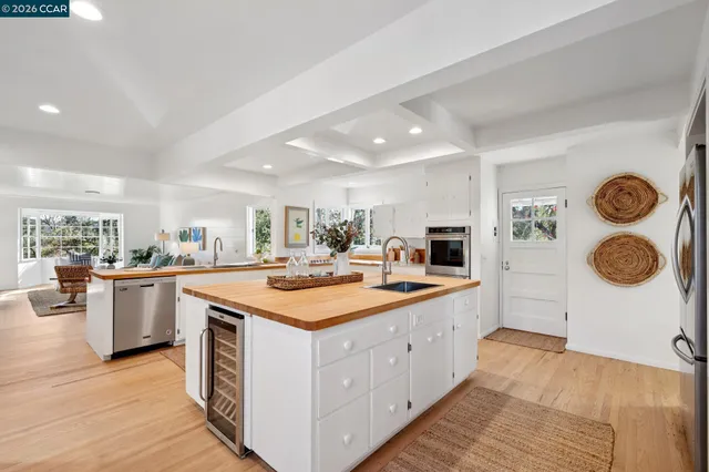 a spacious bedroom with a bed and a large window