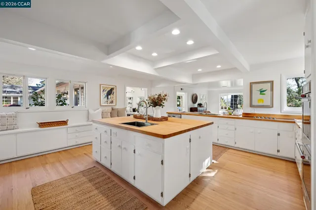 a bedroom with a bed and a potted plant